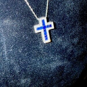 Gorgeous blue sapphire and diamond cross necklace in 10kt white gold